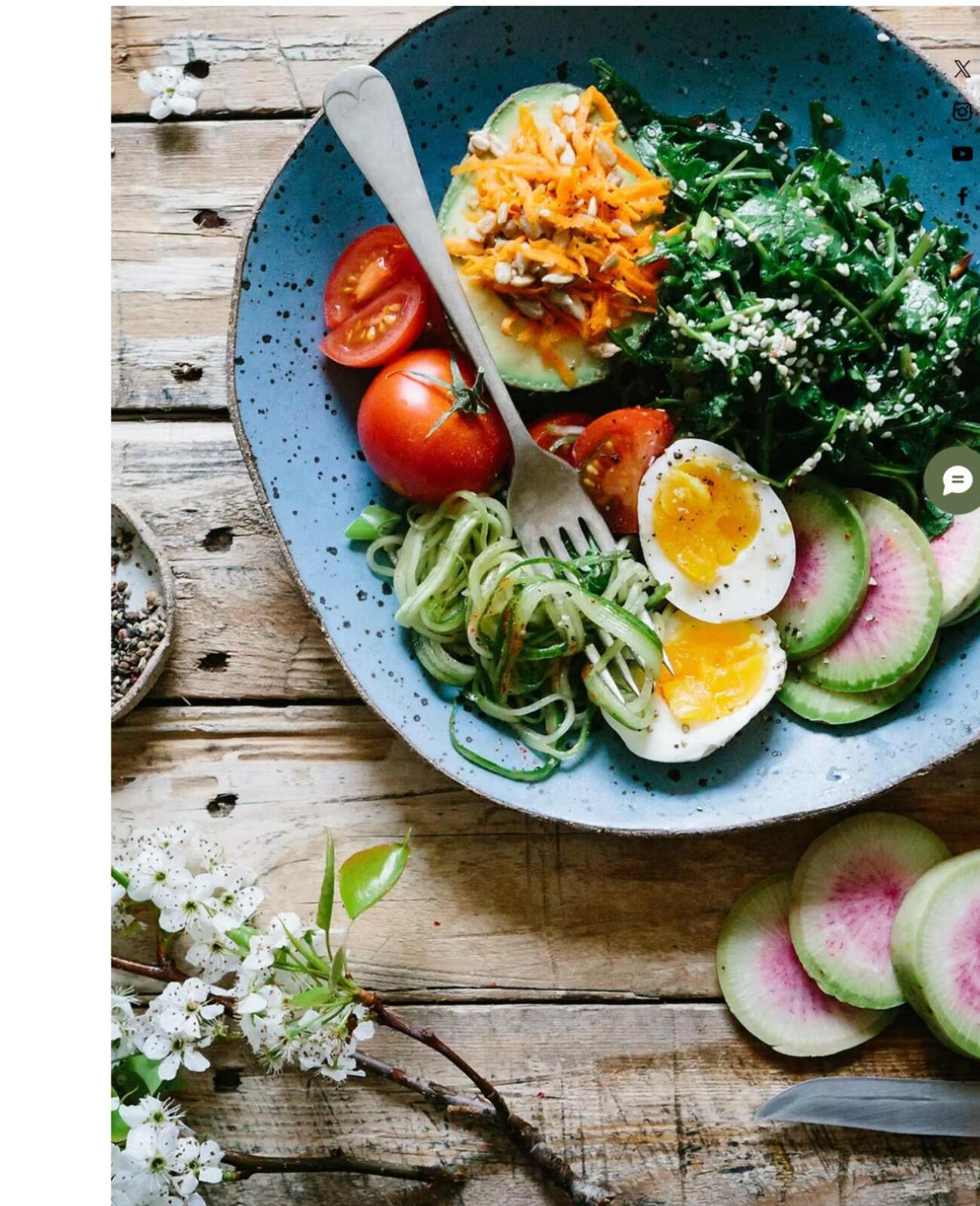 A healthy plate with colorful vegetables, protein, and garnishes